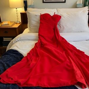 Stunning red dress. Worn once, cost $300. Slit on side. Just cleaned